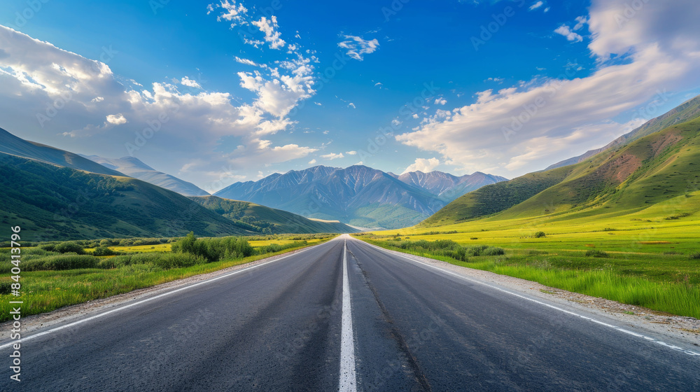 Fototapeta premium Endless Road highway Through Lush Green Mountains 