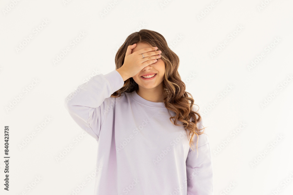 Photo portrait woman closed eyes with hand laughing playing game isolated white color background Photo portrait woman closed eyes with hand laughing playing game isolated white color background