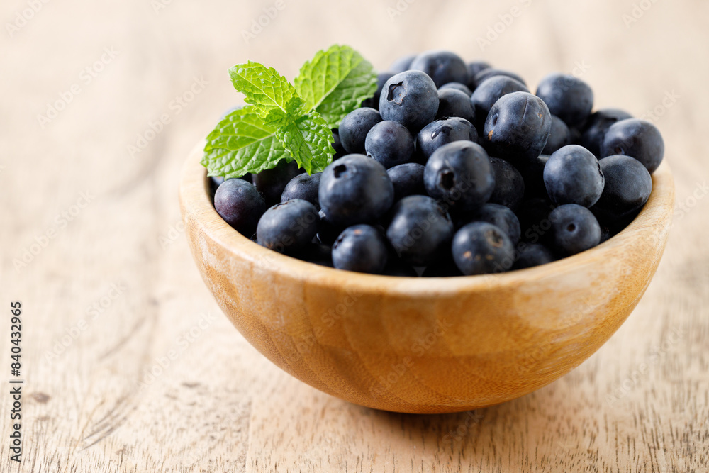 Ripe organic blueberries on wooden table background. Selective focus. Ripe organic blueberries on wooden table background. Selective focus.