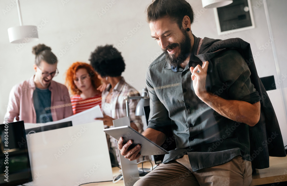 Portrait of happy success man working in a busy modern workplace, Startup coworker concept Portrait of happy success man working in a busy modern workplace, Startup coworker concept