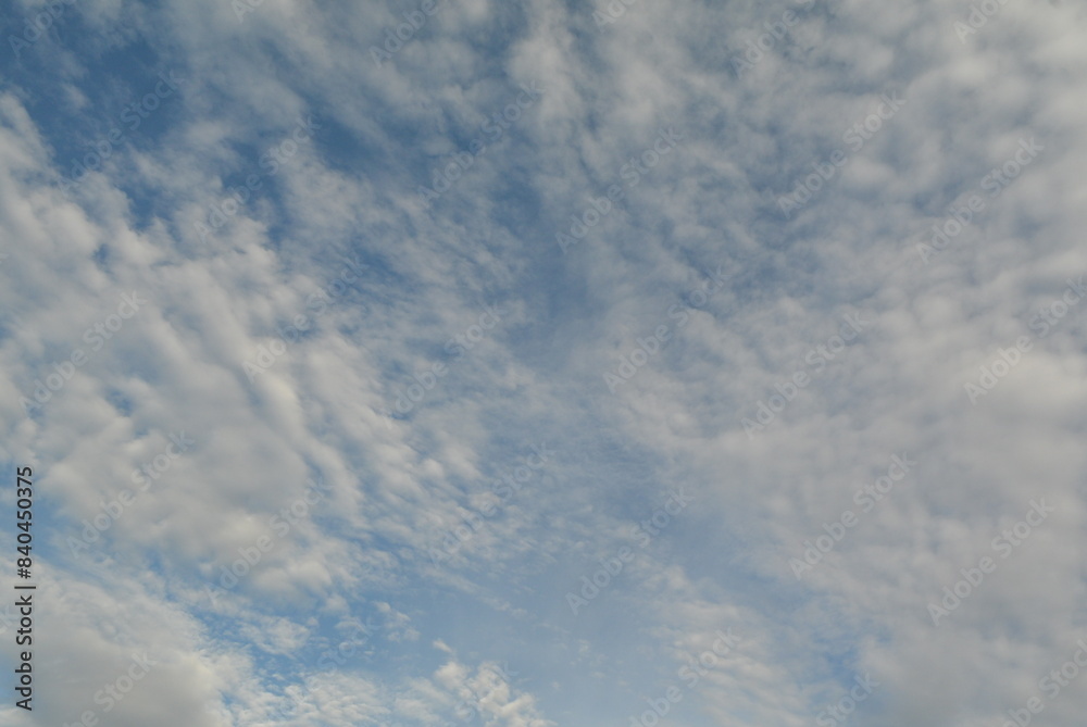 Cirrus and cumulus clouds against a blue sky Cirrus and cumulus clouds against a blue sky