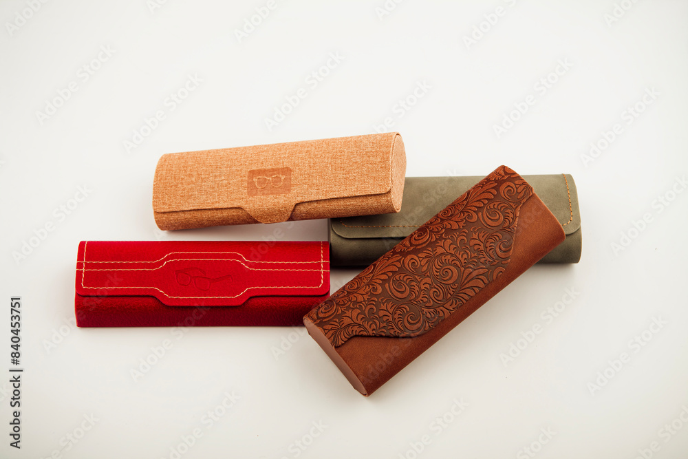 Case for glasses. Glasses in a leather case for storing sunglasses. Magnetic cover. lie horizontally. on an isolated white background. Close-up. place for text. Case for glasses. Glasses in a leather case for storing sunglasses. Magnetic cover. lie horizontally. on an isolated white background. Close-up. place for text.
