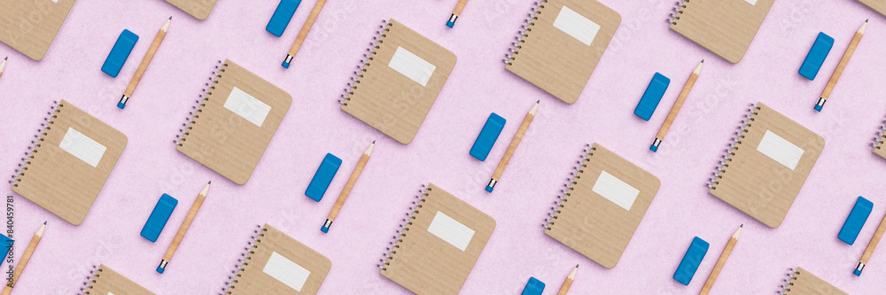 Repetitive flat lay of rows of notepads, rubbers, and pencils on a vibrant purple background concept 3d render Repetitive flat lay of rows of notepads, rubbers, and pencils on a vibrant purple background concept 3d render