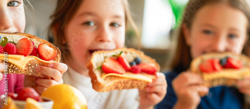 kid eating Delicious breakfast toasts with fresh healthy ingredients