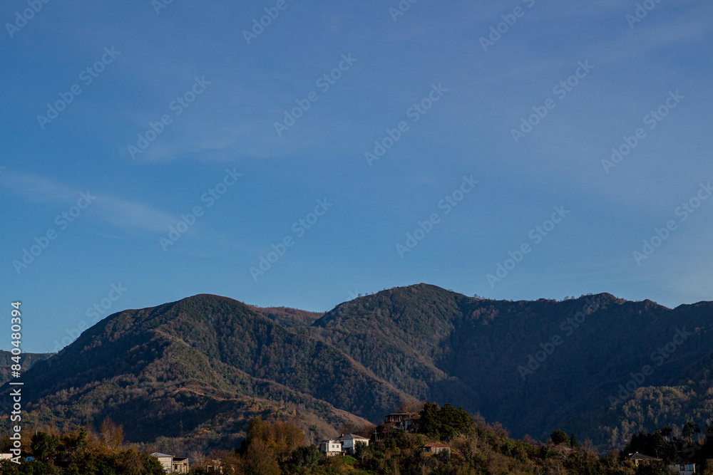 Mountains and clouds. Green mountains in the countryside. Blue sky in mountainous area. Summer holiday in nature. Mountains and clouds. Green mountains in the countryside. Blue sky in mountainous area. Summer holiday in nature.
