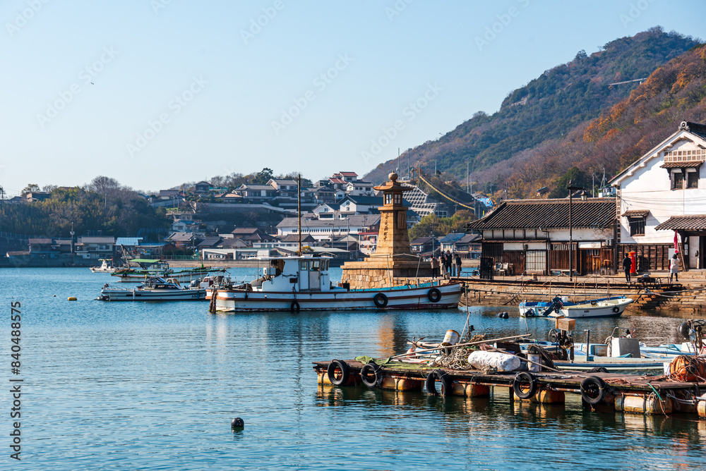View over the small fishing harbor of Tomonoura with famous stone lighthouse and the blue waters, Tomonoura, Honshu View over the small fishing harbor of Tomonoura with famous stone lighthouse and the blue waters, Tomonoura, Honshu