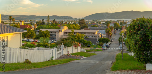 View of suburb street overlooking Knysna at sunset, Knysna, Garden Route, Western Cape