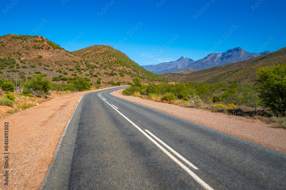 View of road R62 and green mountainous landscape between Zoar and Calitzdorp View of road R62 and green mountainous landscape between Zoar and Calitzdorp