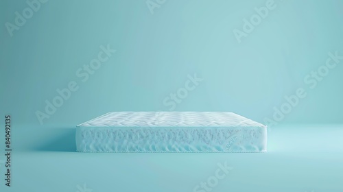 3D rendering of a soft mattress with a textured surface on a blue background. photo