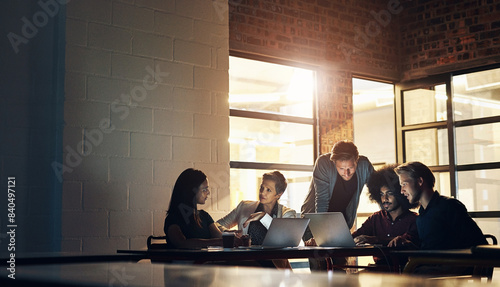 Photography Collaboration, group and night in boardroom, laptop and brainstorming in workspace and teamwork