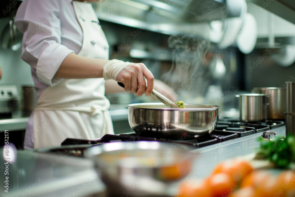 Chef cooking with flames in a professional kitchen. Chef cooking with flames in a professional kitchen.