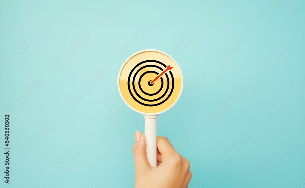 Goal and planning concept, Magnifying glass focus on target aiming dart board, Business achievement objective goal and project progress growth value processing marketing financial, Reach target