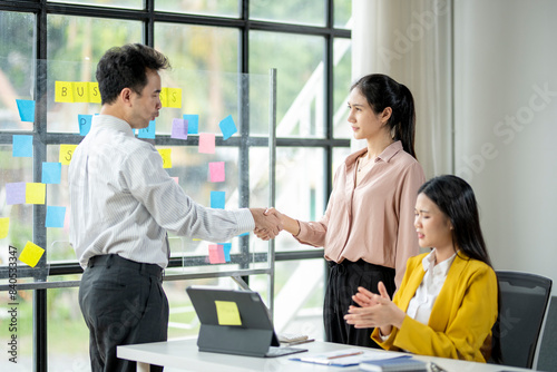 Free Download A man shakes hands with a woman in a pink shirt - GFXLoad