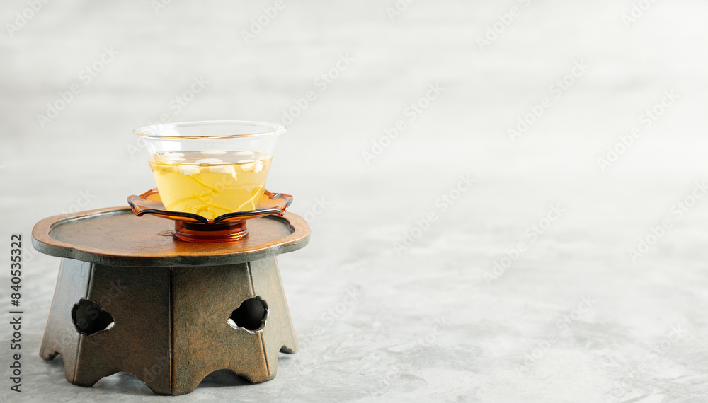 Fotografie Warm ginseng tea on a traditional table