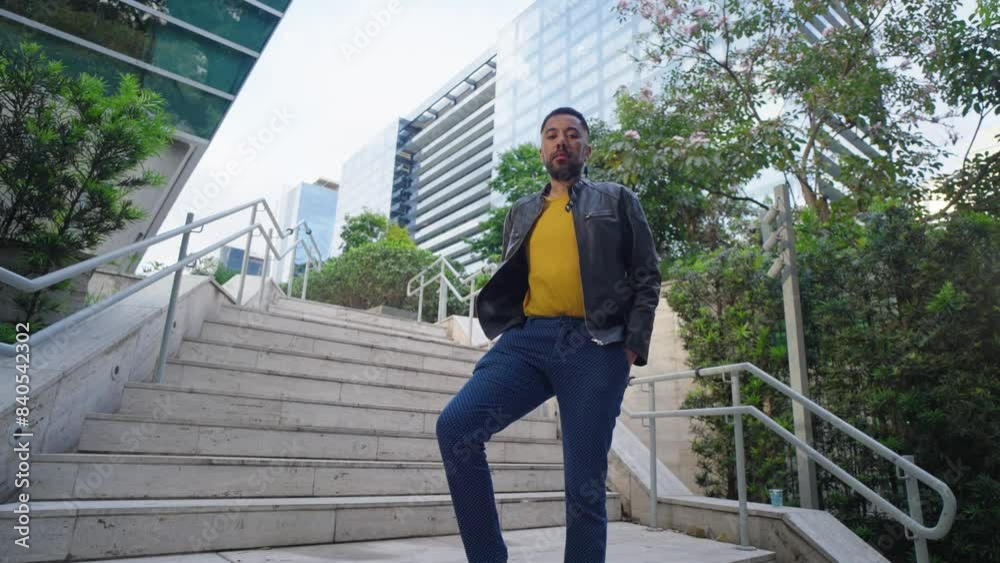 Portrait of serious queer man at city urban background. Confident genderqueer lgbt black man
Portrait of serious queer man at city urban background. Confident genderqueer lgbt black man