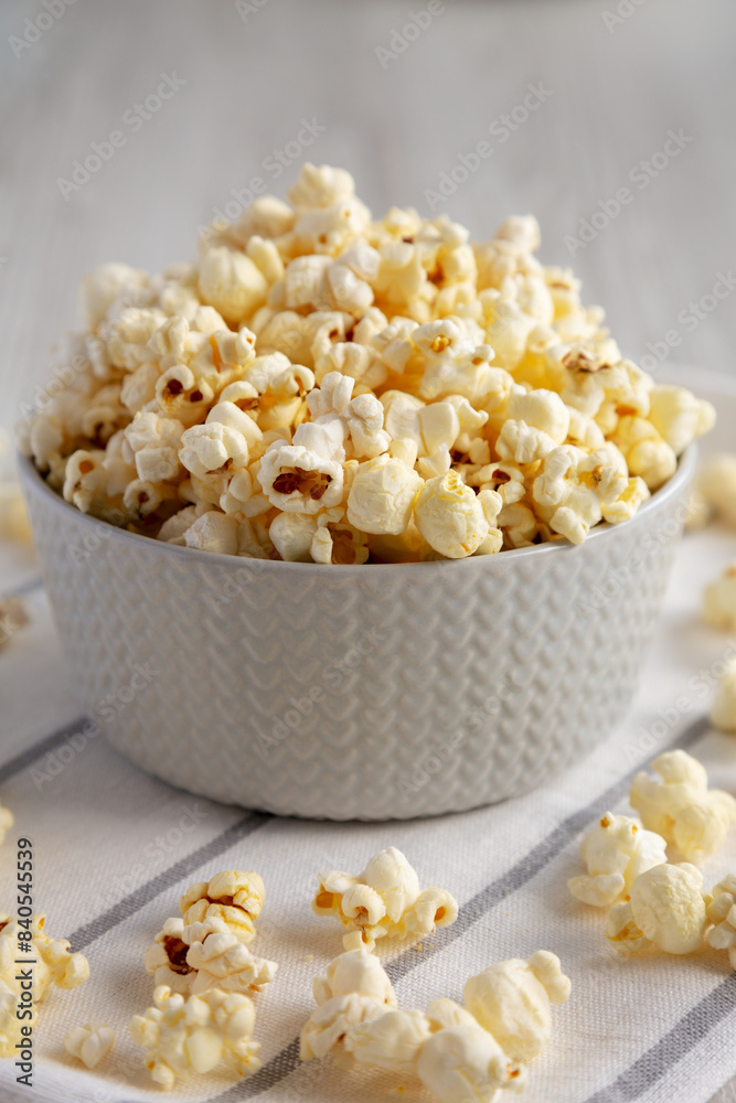 White Buttered Popcorn with Salt in a Bowl, side view. White Buttered Popcorn with Salt in a Bowl, side view.