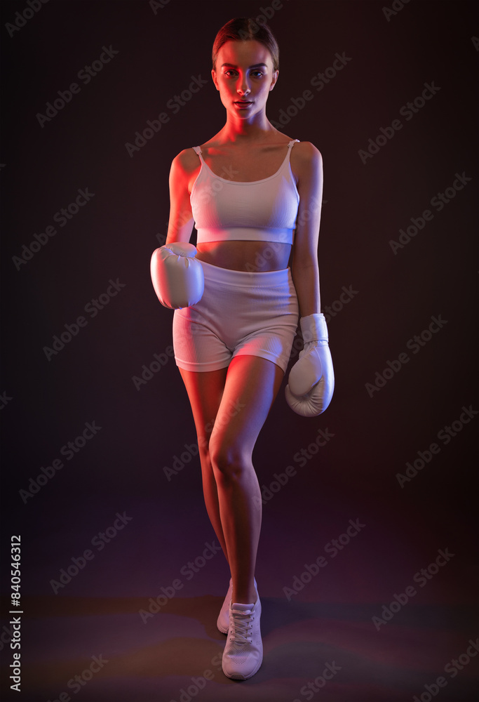 Beautiful sexy girl in a white tracksuit with white boxing gloves on a black background. Beautiful sexy girl in a white tracksuit with white boxing gloves on a black background.