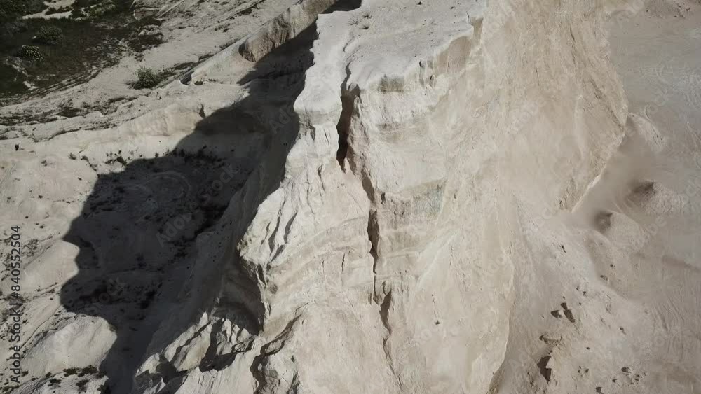 Aerial view of sand rock peak between dunes. Drone footage. Natural video. Aerial view of sand rock peak between dunes. Drone footage. Natural video.