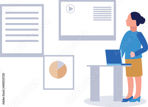 A girl is standing and working on the laptop.