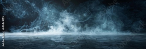 Abstract blue smoke effect with dark background.