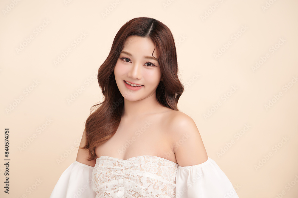 Beautiful young asian woman with clean fresh skin on beige background, Face care, Facial treatment, Cosmetology, beauty and spa, Asian women portrait.