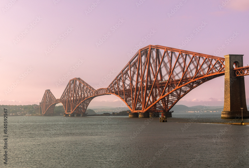 Fototapeta premium The iconic Forth Bridge, a cantilever railway bridge, spans the Firth of Forth west of central Edinburgh. Completed in 1890, it is a UNESCO World Heritage Site.