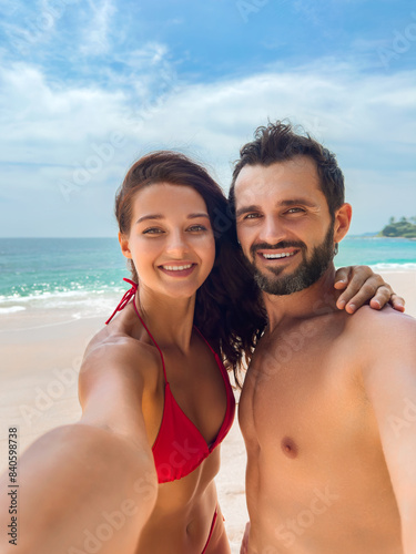 Happy Couple Taking a Selfie on a Sunny Beach Vacation
