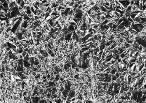 Halftone crumpled aluminium foil vector texture with a transparent background