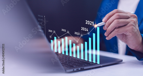 Obraz na płótnie 2024 to 2025 business financial plan market concept, performance of profit growth on 2024, education trend up finance on growth graph money revenue, Businessman analyzes profitability of working. w salonie