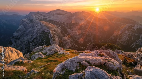 Beautiful mountains range with sunset sky in the background.