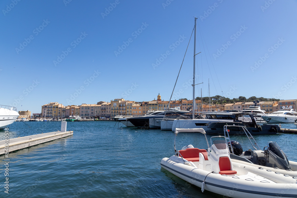 Saint Tropez with the famous Notre Dame de l'Assomption church, marina with yachts and sailing boats on the Cote d'Azur, French Riviera
