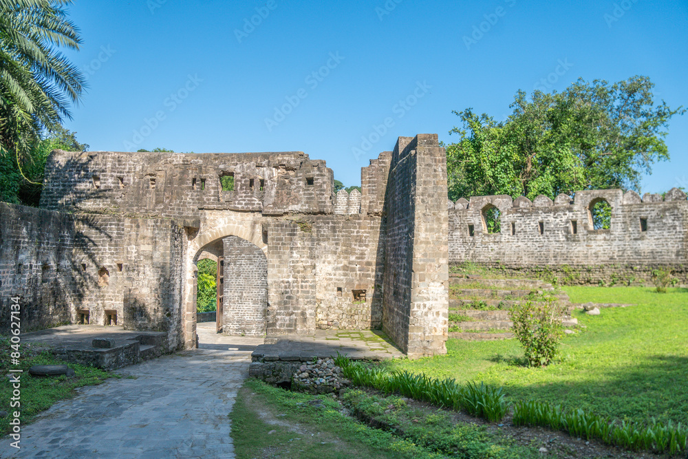 Explore ancient stone Kangra fortress in lush greenery, bathed in sunlight Explore ancient stone Kangra fortress in lush greenery, bathed in sunlight