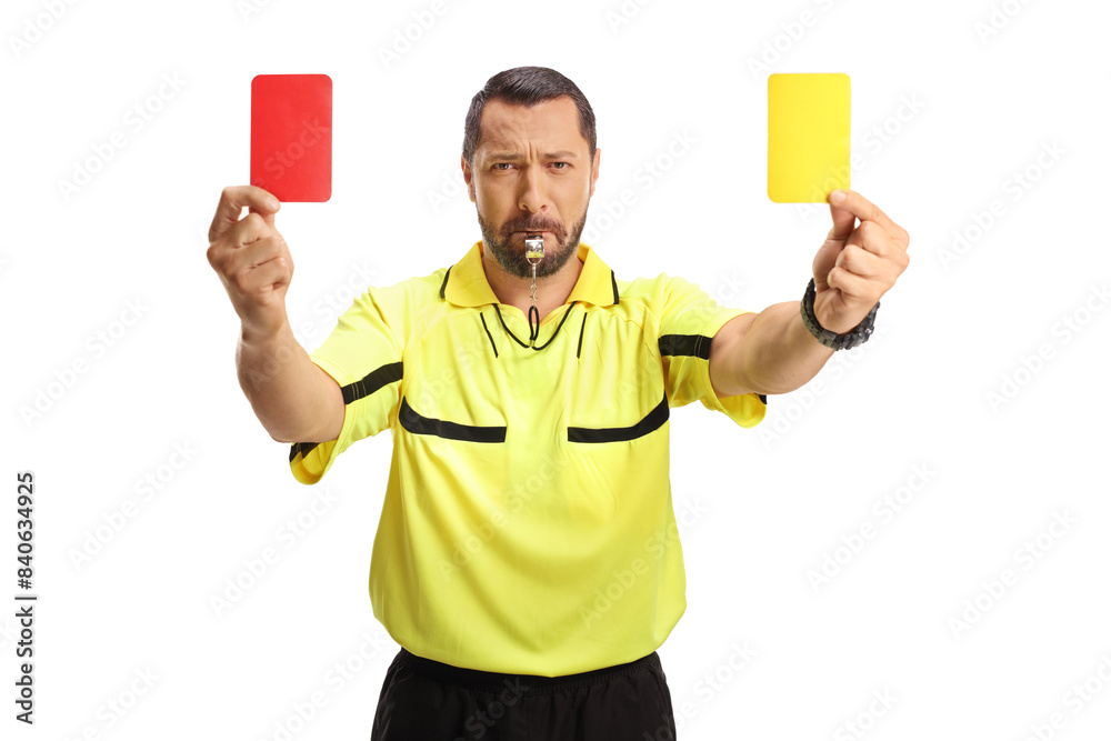 Football referee blowing a whistle and showing a red and yellow card Football referee blowing a whistle and showing a red and yellow card
