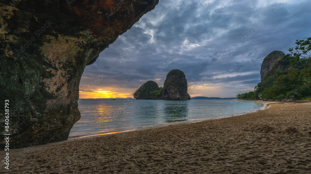 sunset at the princess cave beach on railay beach in thailand