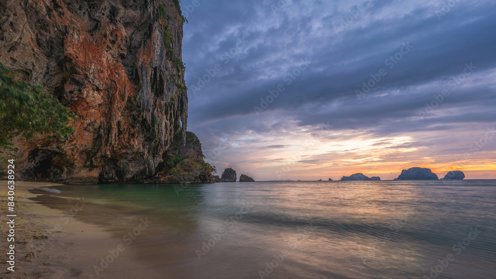 sunset at the princess cave beach on railay beach in thailand