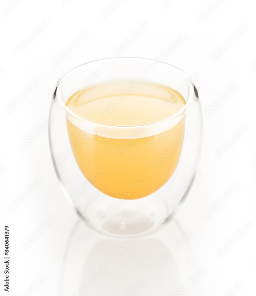 lemon ginger juice in glass isolated on white background. yellow drink lemon ginger juice in glass isolated on white background. yellow drink