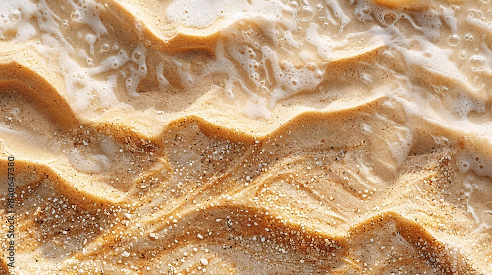 close-up top view of sand and waves close-up top view of sand and waves