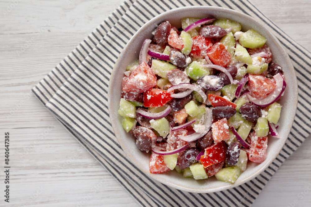 Homemade Chopped Mediterranean Salad in a Bowl, top view. Copy space. Homemade Chopped Mediterranean Salad in a Bowl, top view. Copy space.