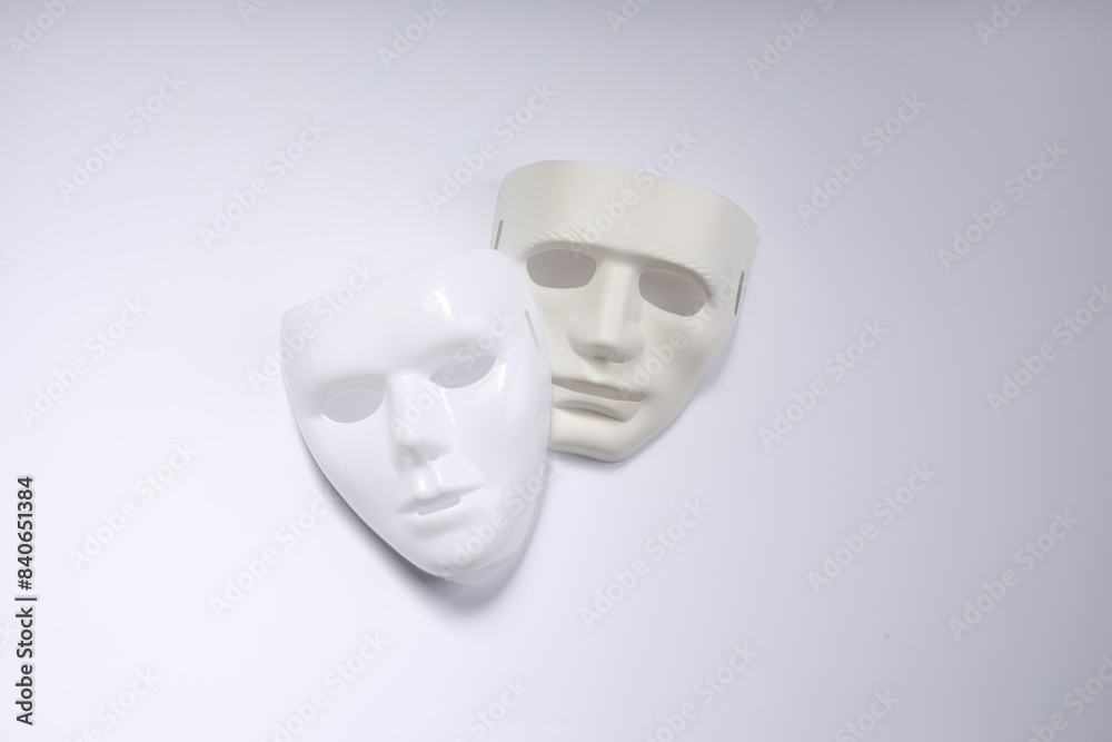 Theater arts. Two masks on white background, top view Theater arts. Two masks on white background, top view