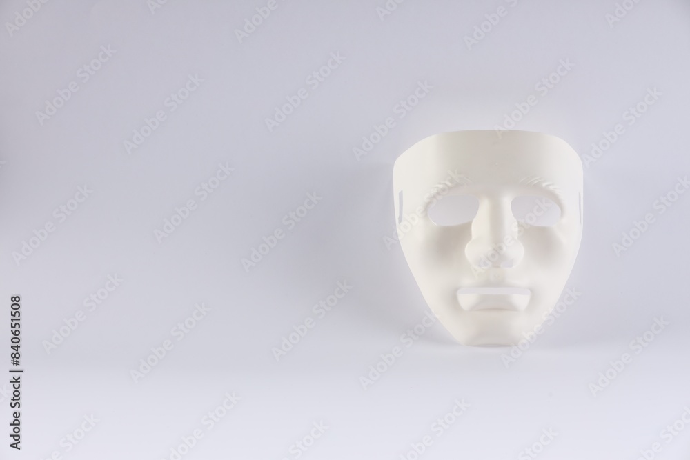 Plastic face mask on white background, space for text. Theatrical performance Plastic face mask on white background, space for text. Theatrical performance