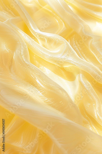 Golden fabric flowing like waves creating an abstract background with copy space