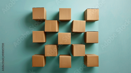 Lot of closed cardboard boxes are lying on a turquoise background  forming a beautiful pattern