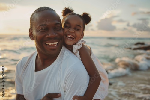 Sunset laughter: Beach embrace with father-daughter