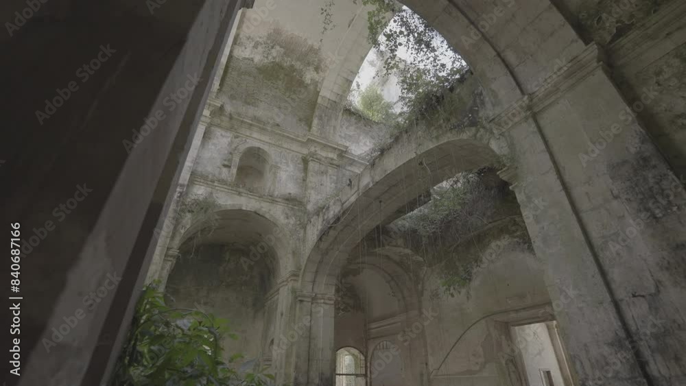 Abandoned church and abbey with arches and vegetation growing on the stone (S-Log 3)