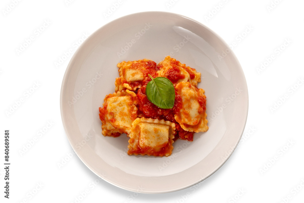 Ravioli with tomato sauce and basil leaf in white plate isolated, top view Ravioli with tomato sauce and basil leaf in white plate isolated, top view
