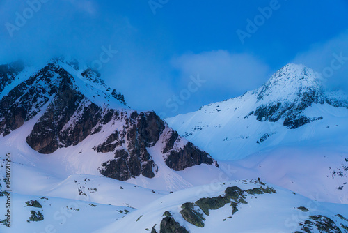 Blue hour landscape view of Belledonne mountain range in French Alps near grenoble