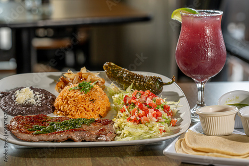 Carne Asada - with Mexican rice, refried pinto beans, and chile toreado. Salsa verde, salsa brava and salsa habanero with Sangria
