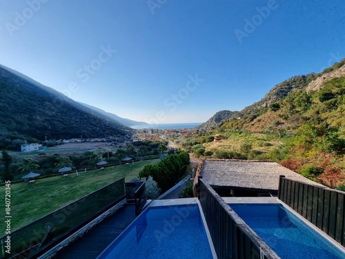 Amazing view from the hotel in Oludeniz, Turkiye onto the mountains on the both sides, blue sky and sea in front