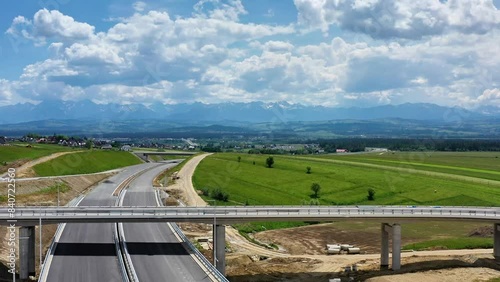 Drone shot of the highway construction from Krakow to Zakopane in the summer. The road will lead into the Polish Tatra Mountains.