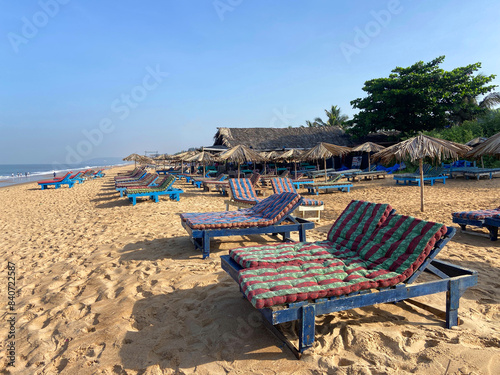 Beach loungers on Cavelossim beach of south Goa, India. photo